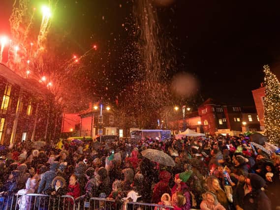 The audience watch the fireworks whilst sprayed with snow. Picture: Keith Woodland