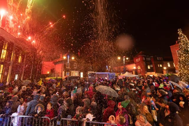 The audience watch the fireworks whilst sprayed with snow. Picture: Keith Woodland