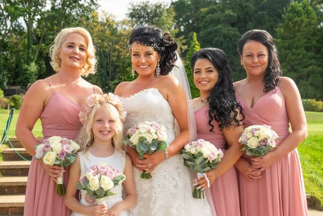 From left: Lisas maid of honour Kate, Tims daughter Holly, Lisa, Lisas daughter Mia and Lisas friend Claire. Picture: Carla Mortimer Photography