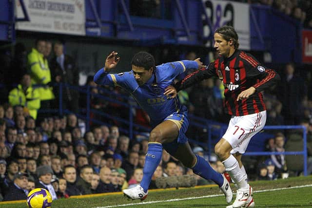 Glen Johnson is held back by AC Milan's Luca Antonini as they battle for the ball. Picture: Chris Ison/PA Wire.