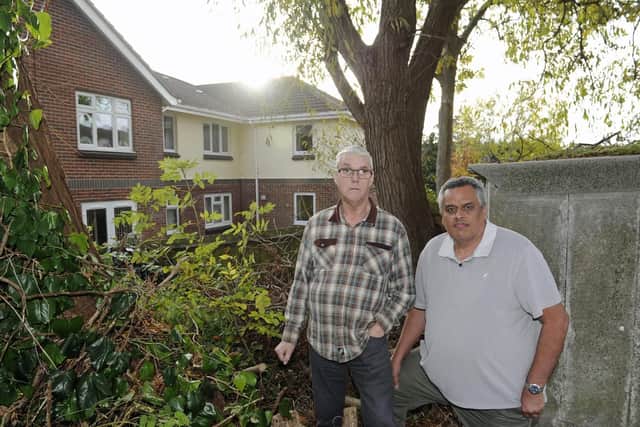 Residents of Beaumont Close in Fareham, Stephen O'Dwyer (right), and Kevin Turner who are concerned at the state of a row of trees which are situated between their properties and a care home. Picture Ian Hargreaves (181104-1_trees)