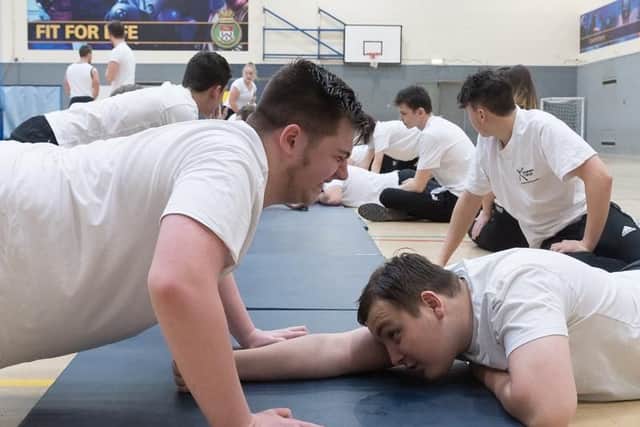 Jack Turner powers through the press-ups. Picture: Keith Woodland