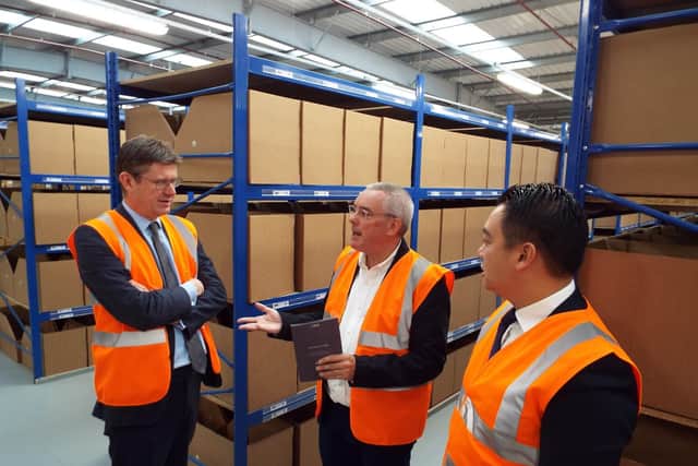 From left, Greg Clark, Simon Ratcliffe and Alan Mak at the Dunsbury Park distribution centre