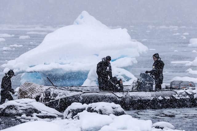 The boats crew of HMS Protector trying to find safe passage through the ice at Port Lockroy.