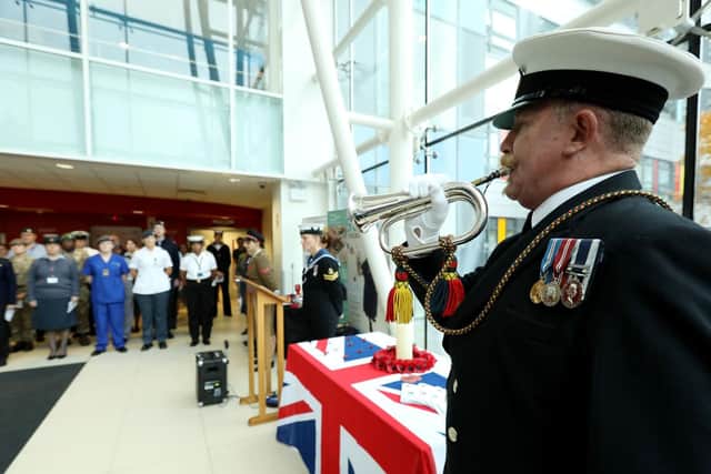 Bugler Neil Silvester of the Royal Naval Volunteers Band, HMS Nelson, plays The Last Post at the Service of Remembrance, Queen Alexandra Hospital, Cosham