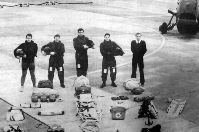 Some crew members with the specialist equipment carried in each aircraft based at HMS Daedalus.