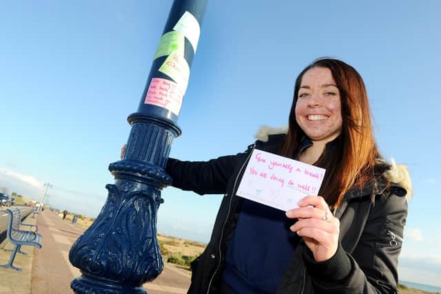 Emily Keel with some of positive notes at Eastney Esplanade. Picture: Sarah Standing