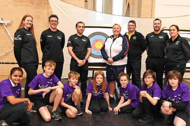 Lorraine Lambert with the group of pupils at Priory School 
Picture: Malcolm Wells (181212-0858)