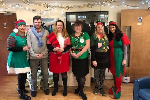 SSJ worker Karen Ward, fare-left, with fellow staff and service users