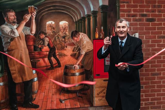 Nigel Atkinson, HM Lord-Lieutenant of Hampshire, unveils the mural on the Old Brewery building in London Road, Horndean