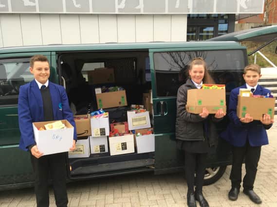 Swanmore College pupils delivering food parcels to the food bank