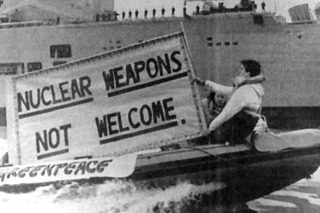 Greenpeace demonstrators circle HMS Ark Royal in protest at its alleged weaponry in 1988.