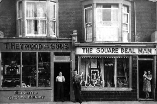 Heywoods cycle shop at 270/272 Lake Road, Portsmouth. Anyone recognise the woman with the baby in the doorway? Picture: Anna Pattenden