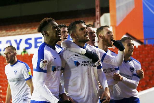 Gareth Evans and his Pompey team-mates celebrate his goal at Barnsley. Picture: Joe Pepler