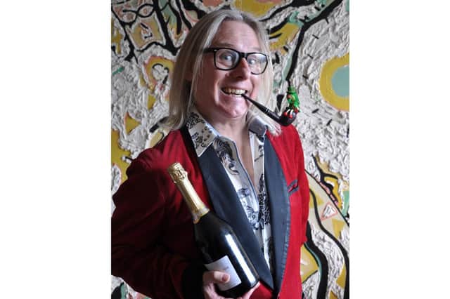 Filmmaker Gavin Irvine, who studied in Portsmouth, with champagne he was awarded after scooping a prize at the Making Waves Festival at the Wedgewood Rooms, Picture: Amel Benmahieddine