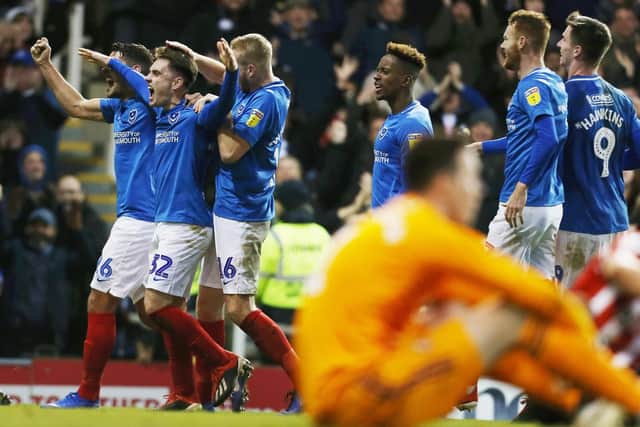 Ben Thompson and his Pompey team-mates celebrate the final goal in the 3-1 win over Sunderland. Picture: Joe Pepler