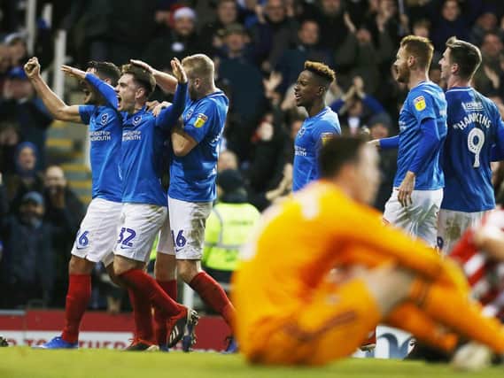 Ben Thompson and his Pompey team-mates celebrate the final goal in the 3-1 win over Sunderland. Picture: Joe Pepler