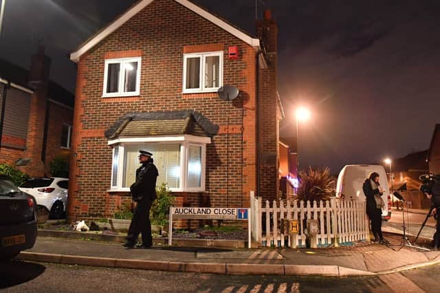A police officer on duty outside a home in Auckland Close, Crawley, West Sussex which has been searched in connection with the drone incident at Gatwick airport. Two people who were arrested have been released without charge and police say they are no longer suspects Picture: Dominic Lipinski/PA Wire