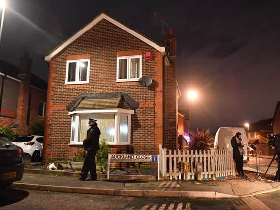 A police officer on duty outside a home in Auckland Close, Crawley, West Sussex which has been searched in connection with the drone incident at Gatwick airport. Two people who were arrested have been released without charge and police say they are no longer suspects Picture: Dominic Lipinski/PA Wire
