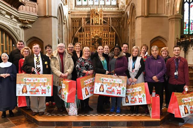 The 'Comfort and Joy' Christmas voucher campaign supported by The News concluded on Friday with a special festival carol service at St Mary's Church, Fratton, in Portsmouth, Hampshire led by Father Bob White when thousands of pounds worth of donations were distributed to each of the deserving charities. Representatives from each good cause were at the event, and enjoyed a good sing-song as they joined in with the carols. Picture by Malcolm Wells