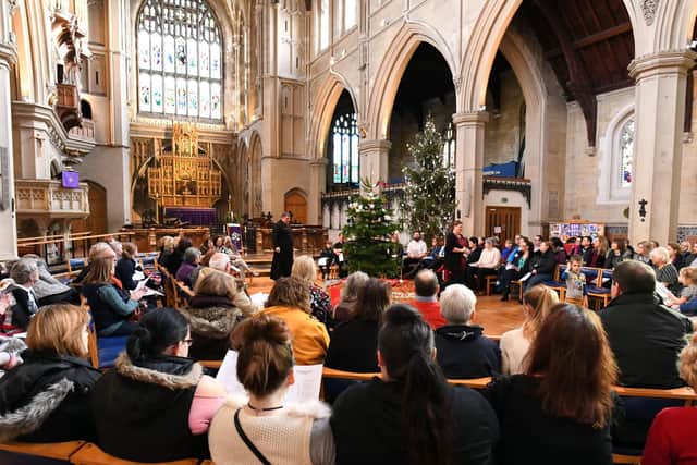 The 'Comfort and Joy' Christmas voucher campaign supported by The News concluded on Friday with a special festival carol service at St Mary's Church, Fratton, in Portsmouth, Hampshire led by Father Bob White when thousands of pounds worth of donations were distributed to each of the deserving charities. Representatives from each good cause were at the event, and enjoyed a good sing-song as they joined in with the carols. Picture by Malcolm Wells