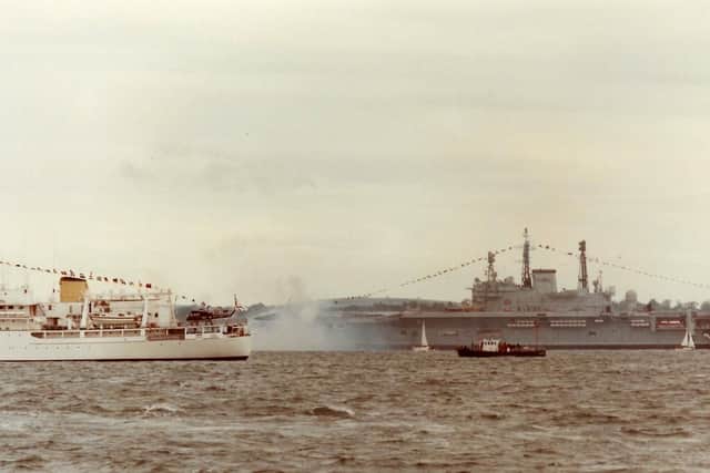 Another from the 1977 Fleet Review and the THV Trinity House vessel Patricia passes HMS Ark Royal.