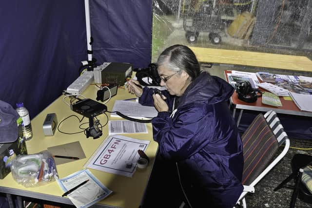 Julia Tribe uses a transceiver at one of the radio club's outreach events.