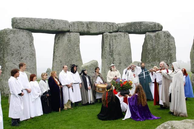 Druids perform a Samhain-style blessing ceremony at Stonehenge in Wiltshire.