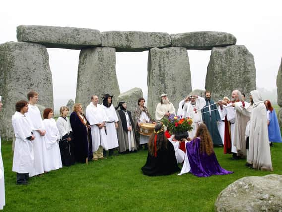 Druids perform a Samhain-style blessing ceremony at Stonehenge in Wiltshire.
