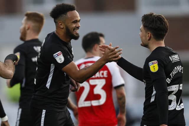The recalled Anton Walkes celebrates with Ben Thompson following Saturday's 5-2 victory at Fleetwood. Picture: Daniel Chesterton