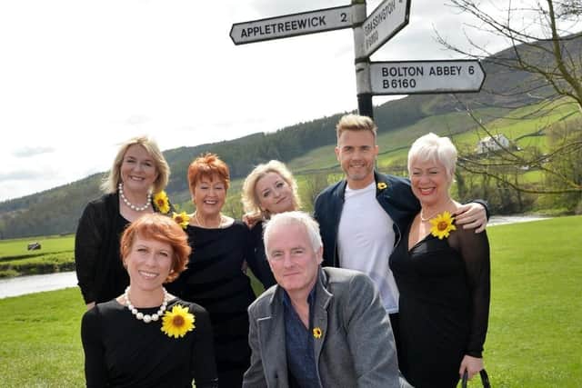 The cast and creatives for Calendar Girls visit the area where the story began/ Back from left: Fern Britton, Ruth Madoc, Rebecca Storm, Gary Barlow and Denise Welch. Front from left: Anna Jane-Casey and Tim Firth