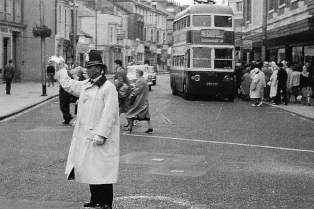 Directing traffic in Osborne Road, Southsea, 1963. If you stood in the same place today you would be run down.
