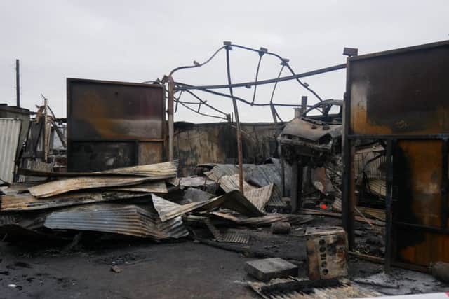 Damage left to the car workshop, including a Ford RS2000
.Picture: Habibur Rahman