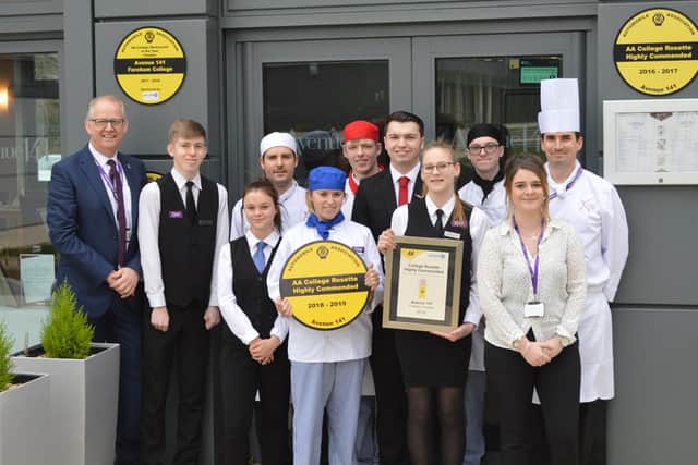 Fareham College Principal, Nigel Duncan (left) celebrates with staff and students from the Colleges award-winning restaurant, Avenue 141