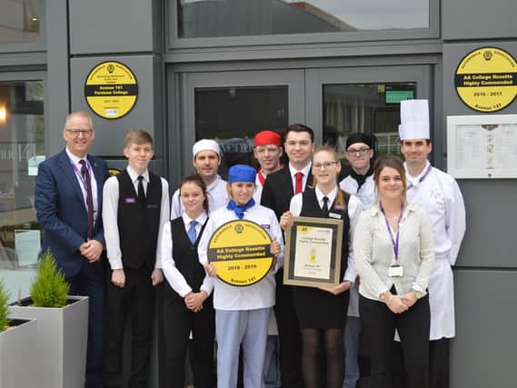 Fareham College Principal, Nigel Duncan (left) celebrates with staff and students from the Colleges award-winning restaurant, Avenue 141