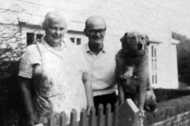 Hetty and Richard (Dick) OShea and Sandy in front of the cottages in the early 1960s.