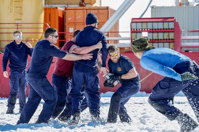 Pictured here are members of HMS Protector's ship's company enjoying a game of Rugby on The Strange Ice Shelf in Antarctica.