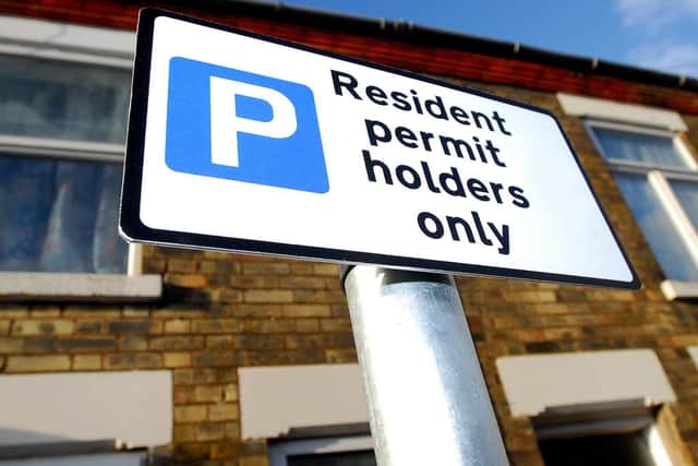 A residents' parking permit sign