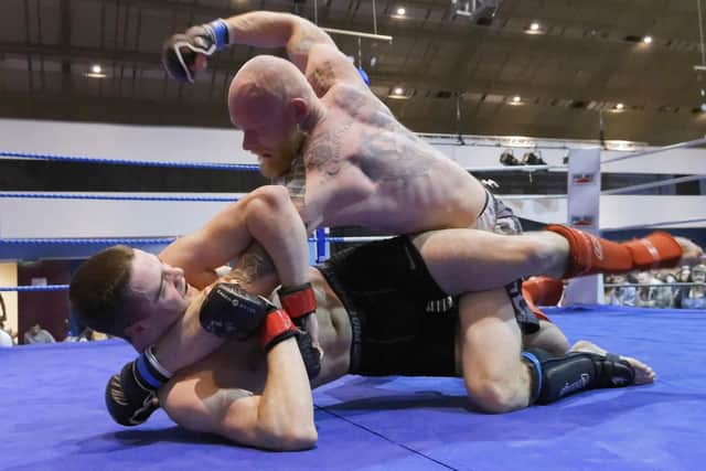 Terry Sharpless from Gym 01 on the offensive against Vectis's Seb Crouch at Shock N Awe: Contenders II. Picture: Neil Marshall (171147-23)