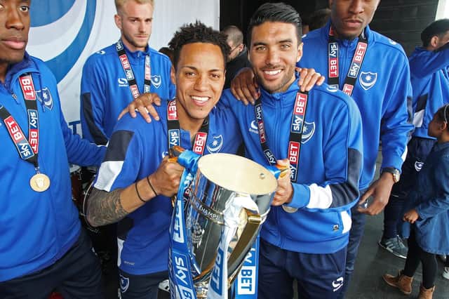 Danny Rose holds the League Two trophy with Kyle Bennett. Picture: Joe Pepler