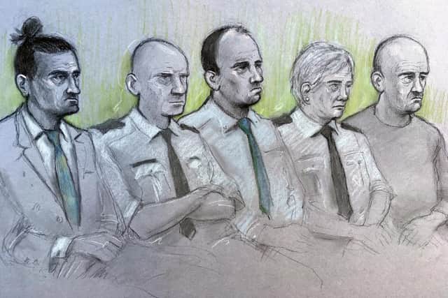 Court artist sketch by Elizabeth Cook of (left to right) David Osborne, male dock officer, Ieuan Harley, female dock officer and Darran Evesham, during their trail at Newport Crown Court for their part in the murder of convicted child killer David Gaut. Picture: Elizabeth Cook/PA Wire