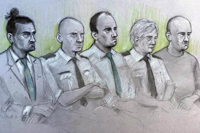 Court artist sketch by Elizabeth Cook of (left to right) David Osborne, male dock officer, Ieuan Harley, female dock officer and Darran Evesham, during their trail at Newport Crown Court for their part in the murder of convicted child killer David Gaut. Picture: Elizabeth Cook/PA Wire