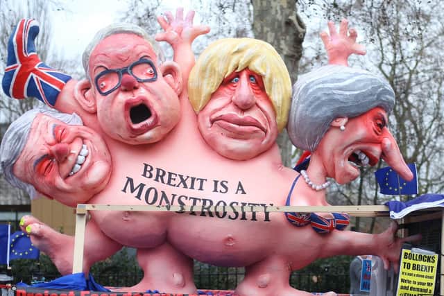 Effigies of Prime Minister Theresa May, former foreign secretary Boris Johnson, current Environment Secretary Michael Gove and former Brexit secretary David Davis, are driven past the Houses of Parliament, London