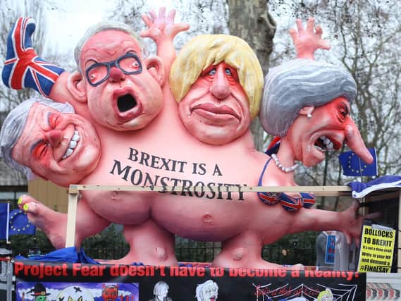 Effigies of Prime Minister Theresa May, former foreign secretary Boris Johnson, current Environment Secretary Michael Gove and former Brexit secretary David Davis, are driven past the Houses of Parliament, London
