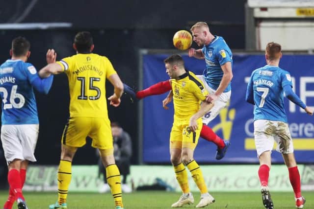 Jack Whatmough wins a header as Pompey take on Oxford Picture: Joe Pepler