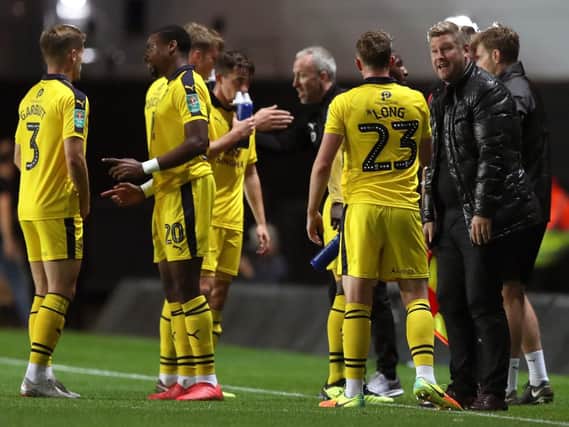 Oxford United manager Karl Robinson and his players. Picture: PA