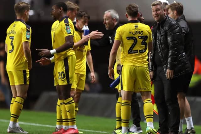Oxford United manager Karl Robinson and his players. Picture: PA
