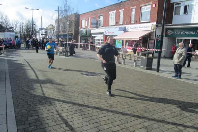 Racers take part in a previous Waterlooville Pancake Race in the town's precinct