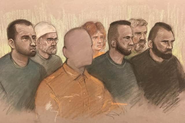 Court artist sketch by Elizabeth Cook of (left to right) Norbert Pulko, Saied Hussini, father of three year boy (cannot be identified), Martina Badiova, Adam Cech, Jabar Paktia and Jan Dudi, in the dock at Worcester Crown Court charged for their alleged part in an attack on the child who was squirted with acid. Picture: Elizabeth Cook/PA Wire