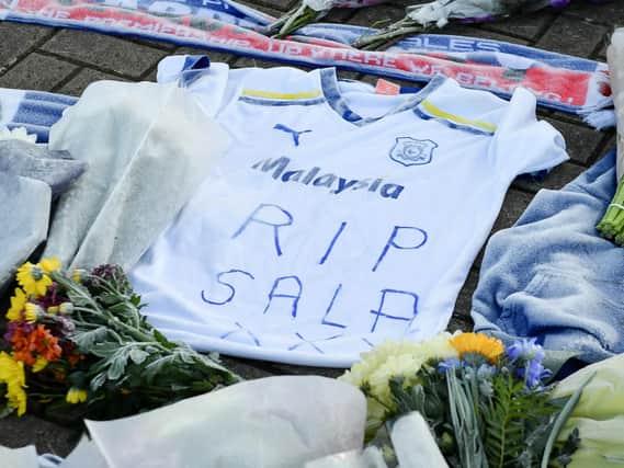Tributes left outside Cardiff City Football Club after a plane with new signing Emiliano Sala on board went missing over the English Channel on Monday night. Picture: Ben Birchall/PA Wire